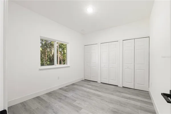 an empty room with a empty space and window