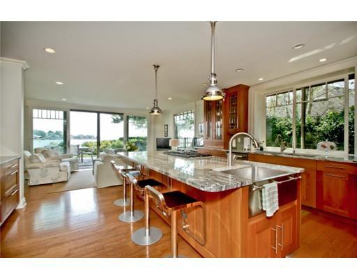 120 Cummings Point Road Stamford, CT 06902 - Photo 4 of 10 a kitchen with stainless steel appliances granite countertop a table chairs and a view of living room
