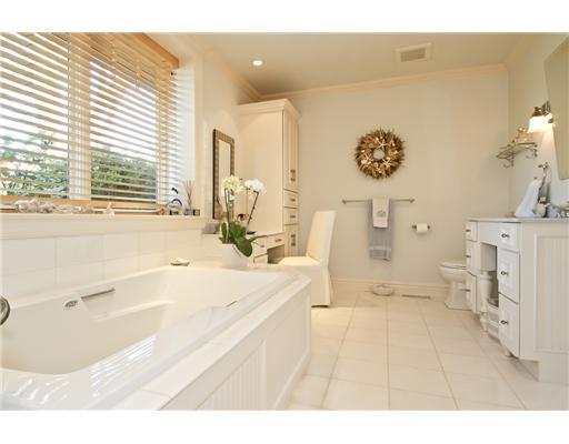 120 Cummings Point Road Stamford, CT 06902 - Photo 7 of 10 a spacious bathroom with a tub sink and a large mirror