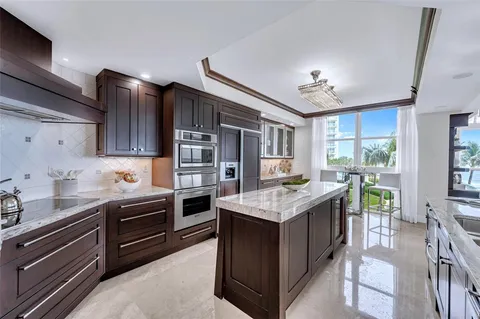 a kitchen with a stove and a refrigerator