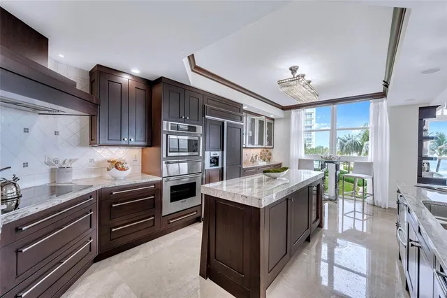 a kitchen with a stove and a refrigerator