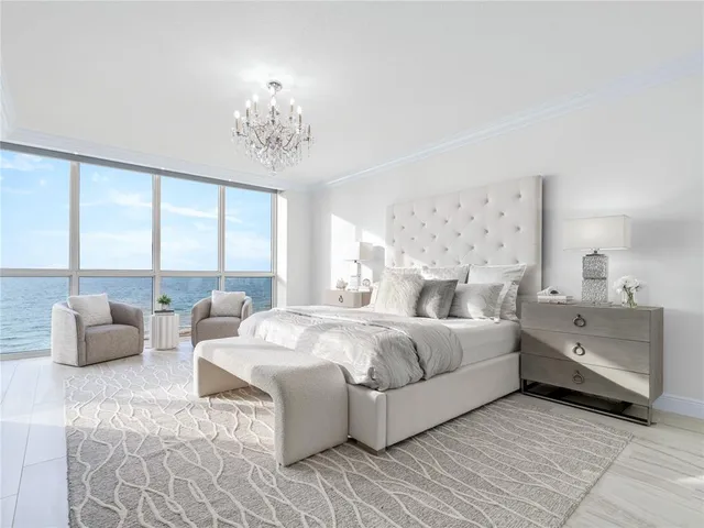 a spacious bedroom with a bed and a couch