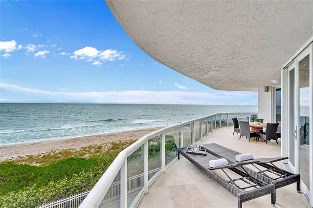 a view of swimming pool with seating area