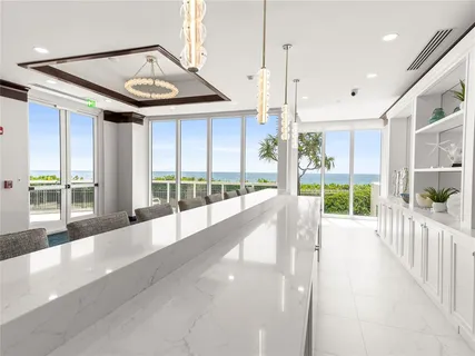 a view of a house with a porch and garden