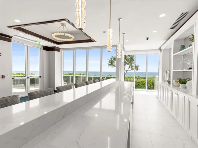 a view of a house with a porch and garden