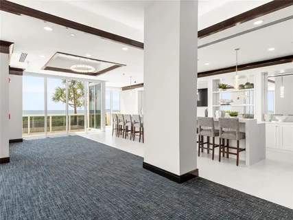 a view of a livingroom with furniture and a window