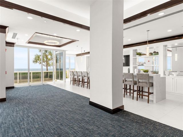 a view of a livingroom with furniture and a window