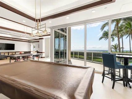 a view of a livingroom with furniture and a potted plant
