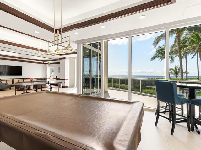 a view of a livingroom with furniture and a potted plant