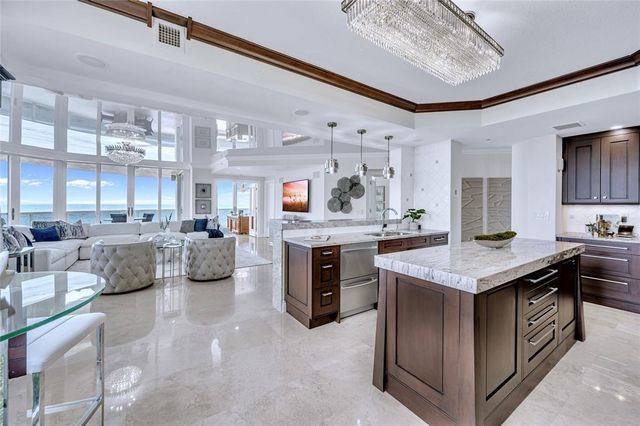 a kitchen with stainless steel appliances granite countertop a lot of counter top space