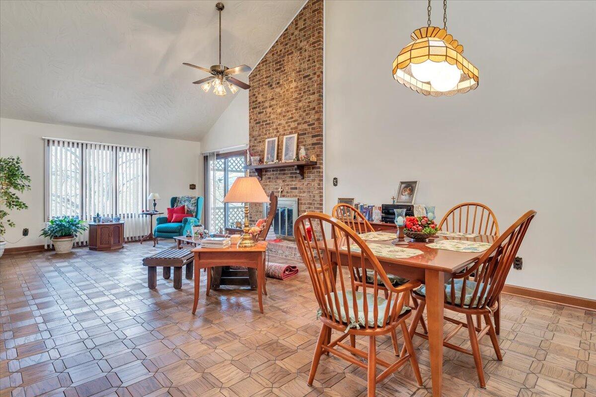 2409 South Clearing Road Salem, VA 24153 - Photo 13 of 45 a dining room with furniture and a chandelier