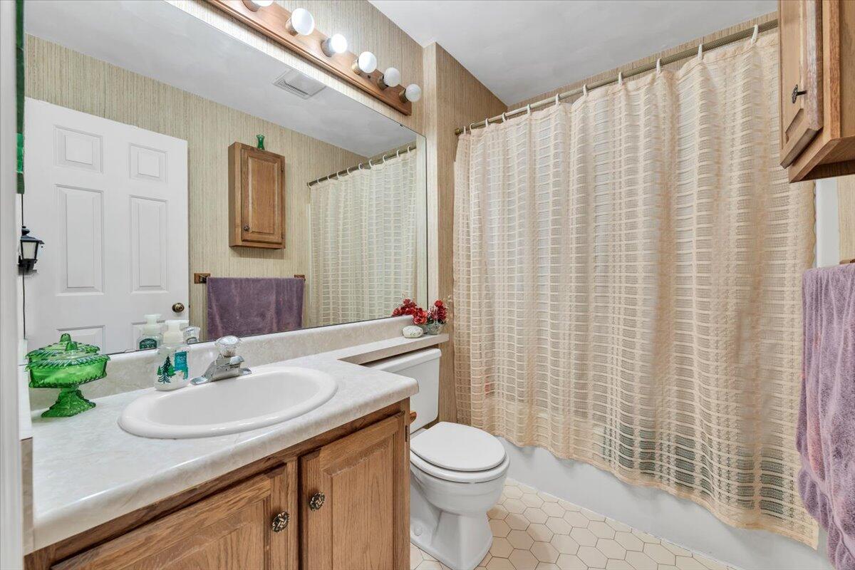 2409 South Clearing Road Salem, VA 24153 - Photo 20 of 45 a bathroom with a granite countertop sink and a mirror