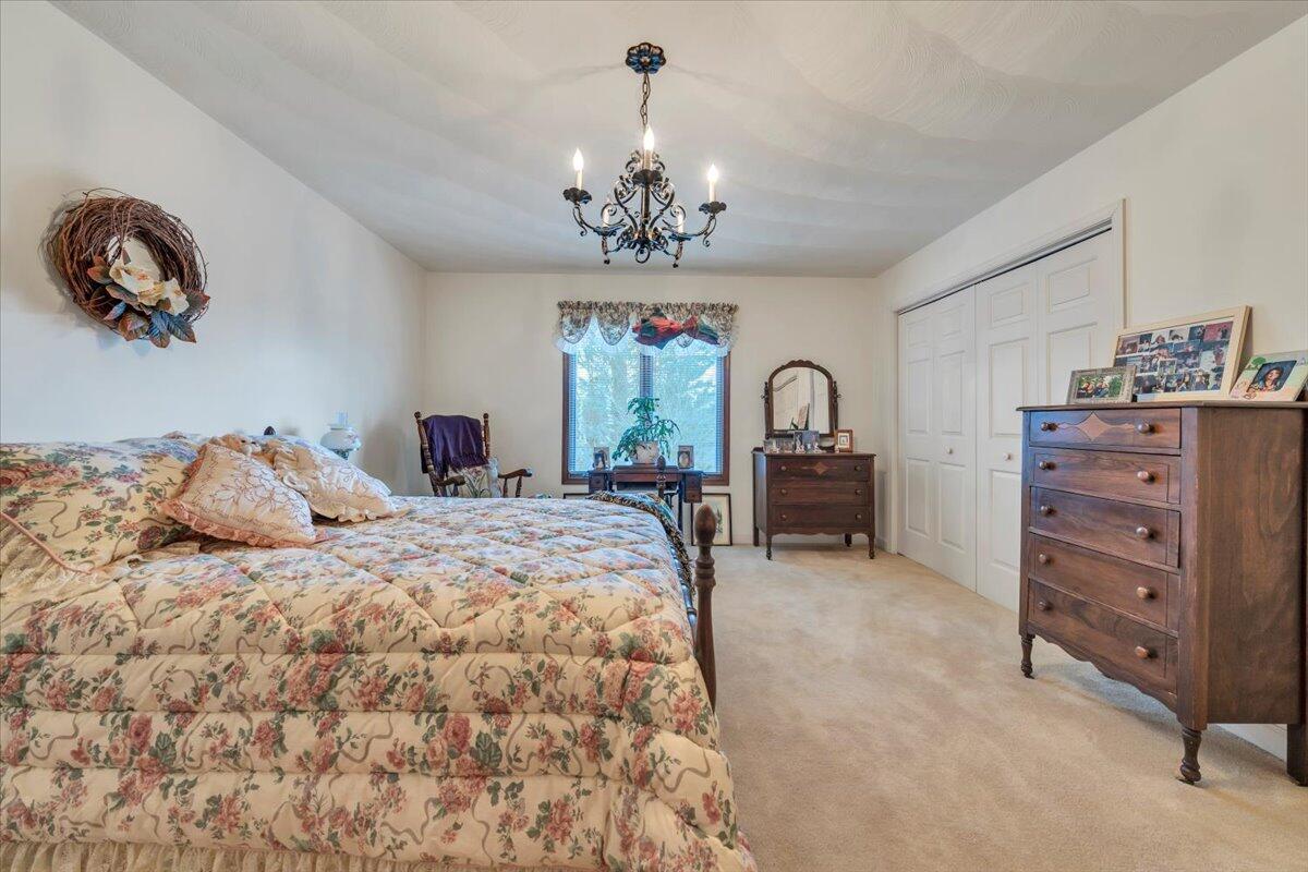 2409 South Clearing Road Salem, VA 24153 - Photo 21 of 45 a bedroom with a bed and a dresser