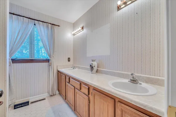 a bathroom with a sink and a mirror