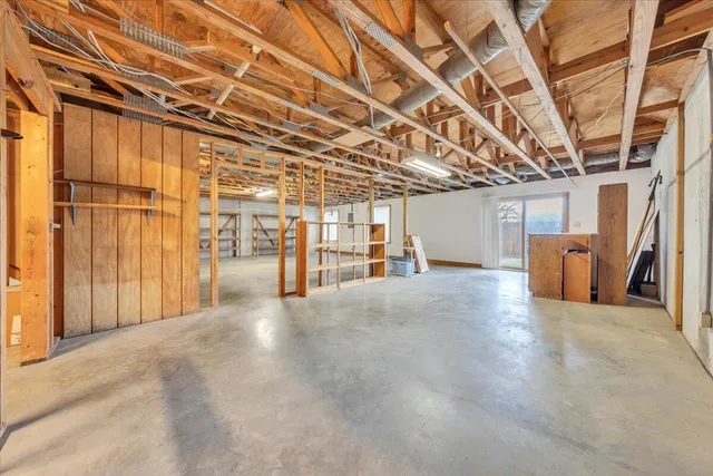 a view of a room with wooden walls