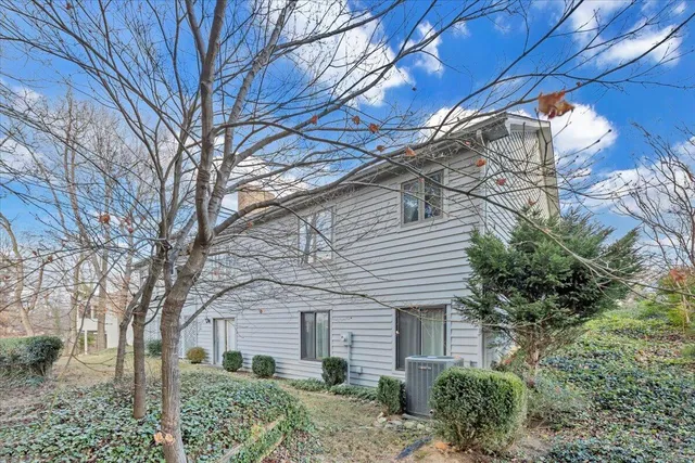 a view of house with a yard