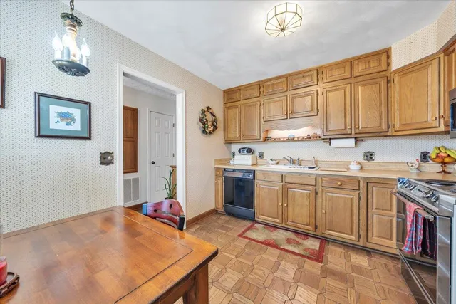 a kitchen with cabinets and window