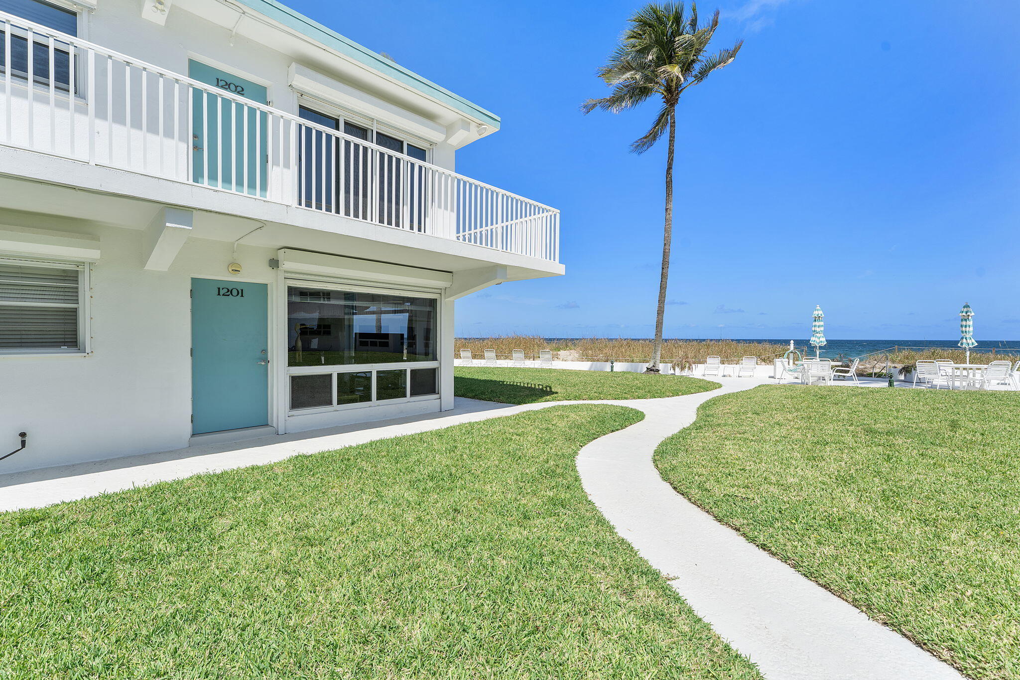 1470 South Ocean Boulevard, Unit 901 Lauderdale-by-the-Sea, FL 33062 - Photo 2 of 13 a view of a house with a swimming pool
