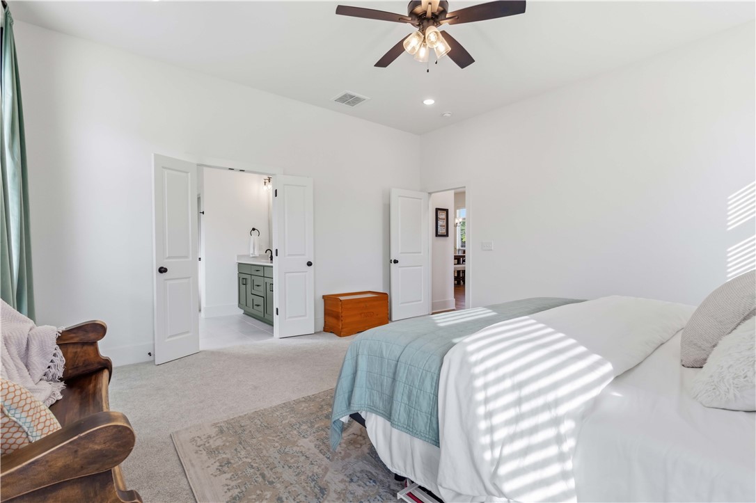 450 Fox Trail Springdale, AR 72762 - Photo 13 of 38 Carpeted room with a ceiling fan and recessed lighting
