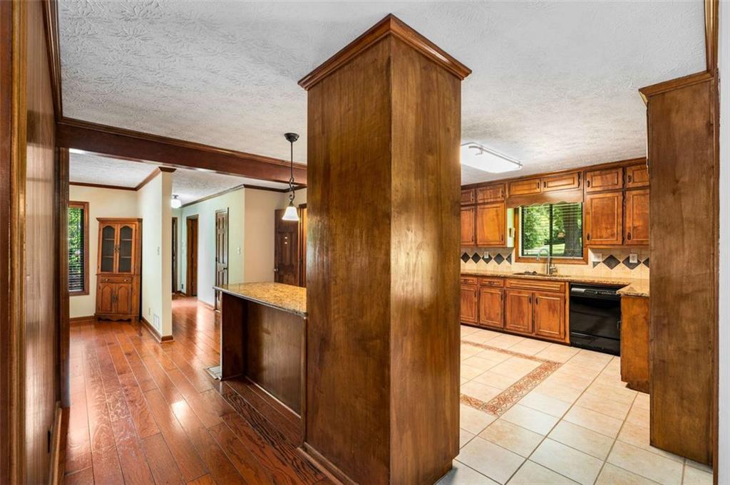 1535 Pathfinder Way Southwest Lilburn, GA 30047 - Photo 11 of 58 a kitchen with stainless steel appliances a refrigerator and a stove