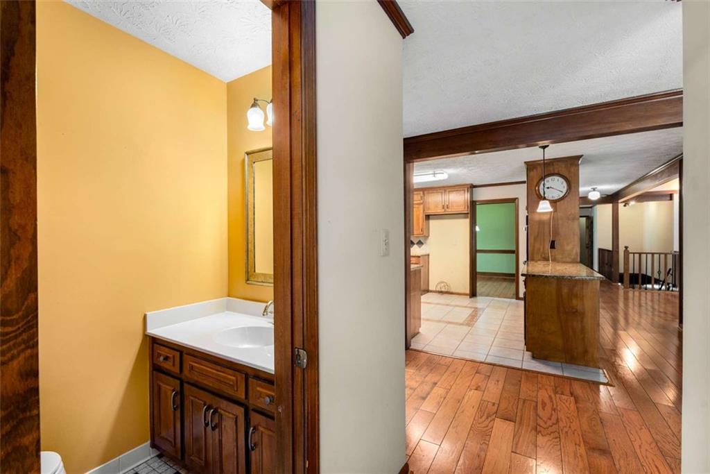 1535 Pathfinder Way Southwest Lilburn, GA 30047 - Photo 21 of 58 a view of a hallway view with wooden floor and staircase