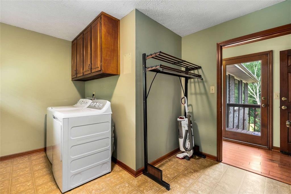 1535 Pathfinder Way Southwest Lilburn, GA 30047 - Photo 22 of 58 a utility room with closet
