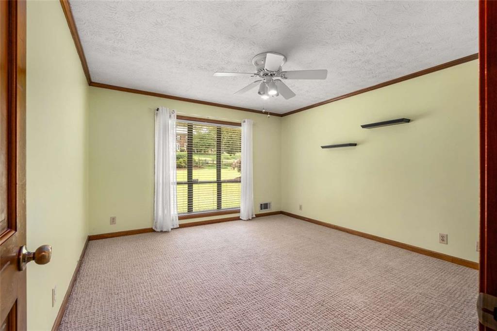 1535 Pathfinder Way Southwest Lilburn, GA 30047 - Photo 23 of 58 an empty room with windows