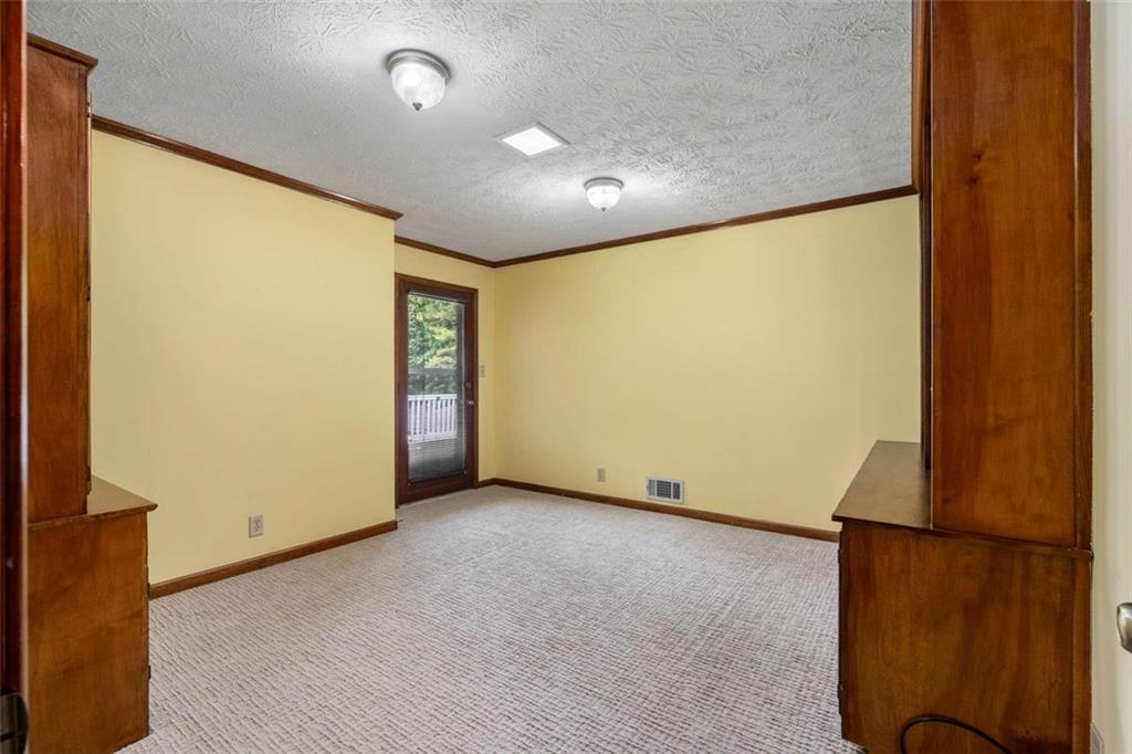 1535 Pathfinder Way Southwest Lilburn, GA 30047 - Photo 25 of 58 an empty room with windows