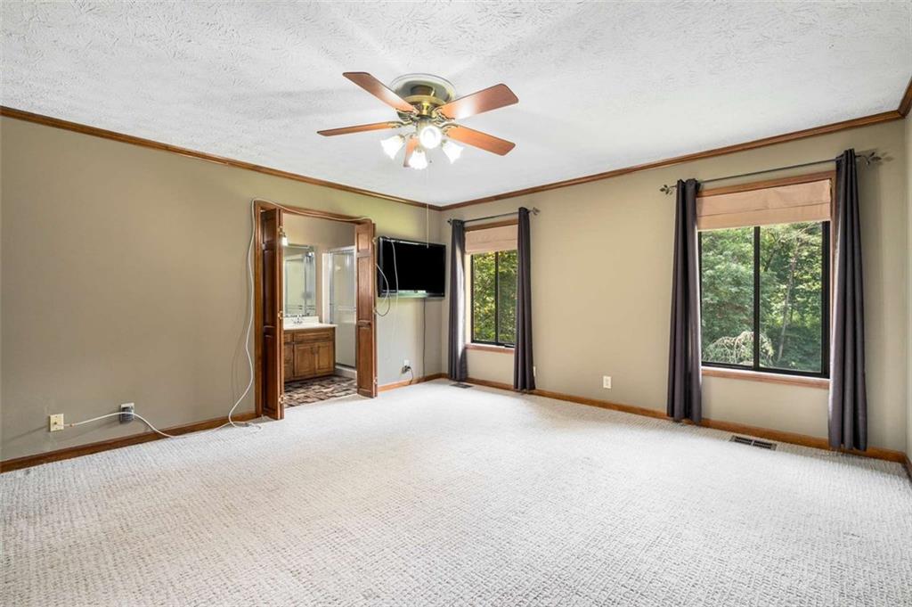 1535 Pathfinder Way Southwest Lilburn, GA 30047 - Photo 27 of 58 a view of a livingroom with a ceiling fan and window