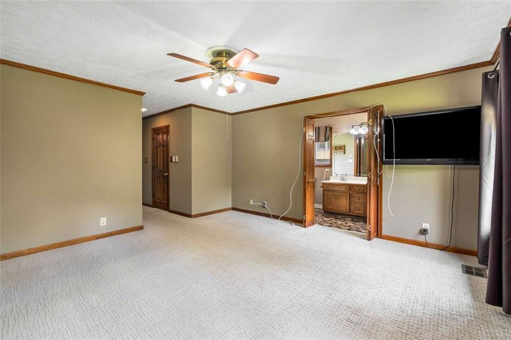 1535 Pathfinder Way Southwest Lilburn, GA 30047 - Photo 28 of 58 a view of a livingroom with a flat screen tv