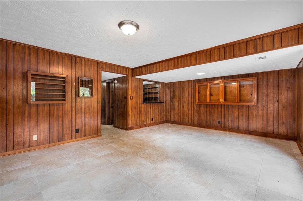1535 Pathfinder Way Southwest Lilburn, GA 30047 - Photo 36 of 58 an empty room with furniture and window