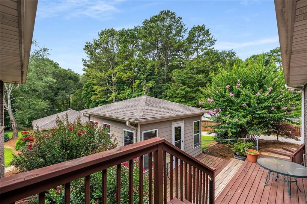 1535 Pathfinder Way Southwest Lilburn, GA 30047 - Photo 38 of 58 a view of a wooden deck with a yard