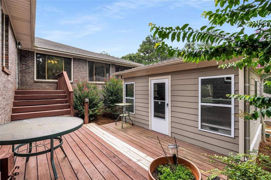 1535 Pathfinder Way Southwest Lilburn, GA 30047 - Photo 39 of 58 a view of house with backyard outdoor seating and green space