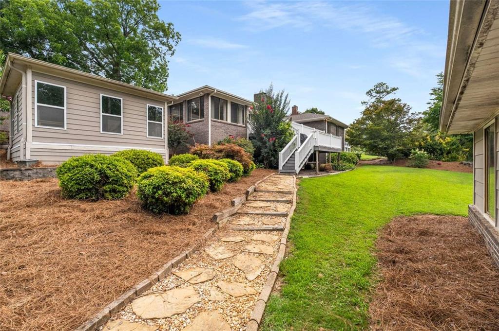 1535 Pathfinder Way Southwest Lilburn, GA 30047 - Photo 43 of 58 a house with garden in front of it