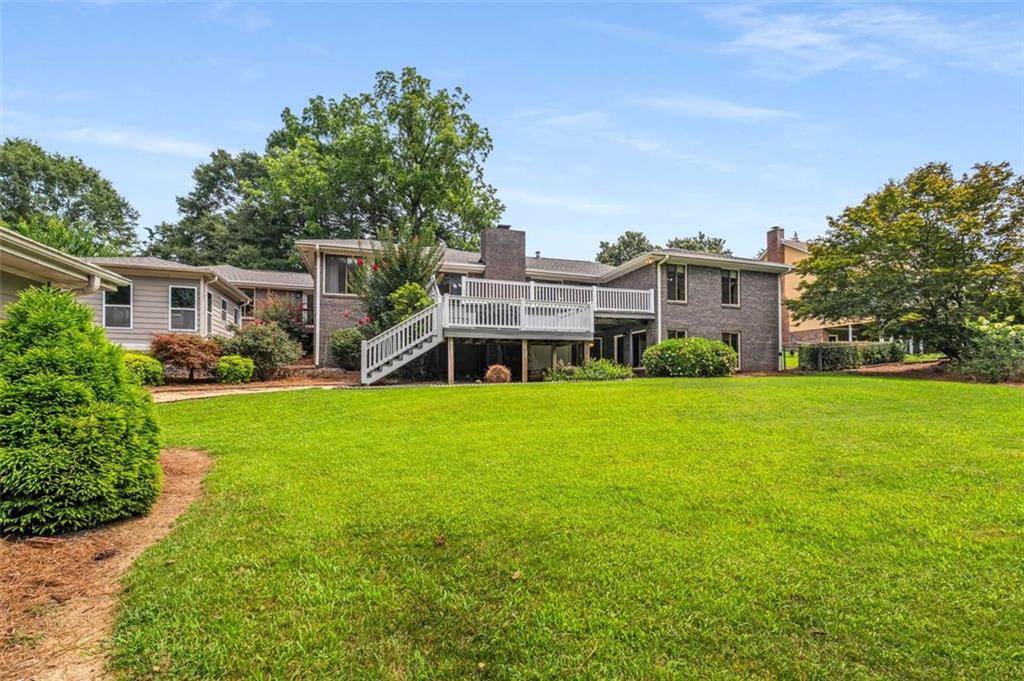 1535 Pathfinder Way Southwest Lilburn, GA 30047 - Photo 45 of 58 a front view of house with yard and green space