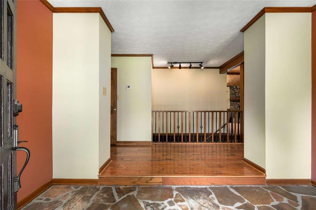 1535 Pathfinder Way Southwest Lilburn, GA 30047 - Photo 5 of 58 a view of a room with a wooden door