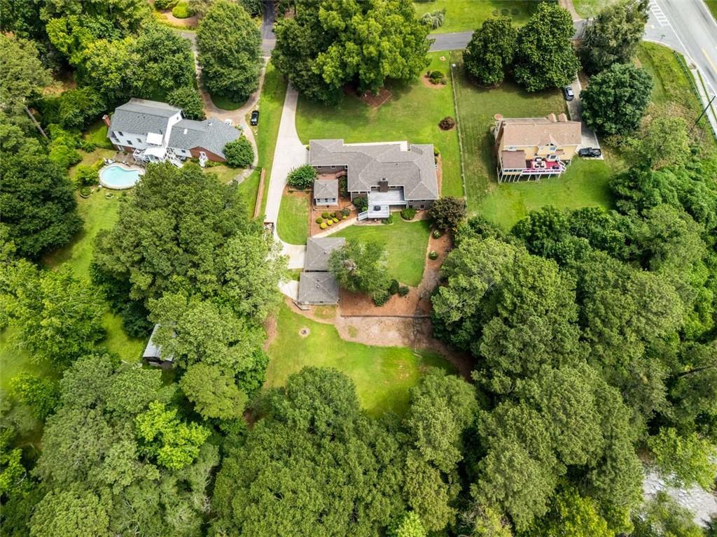 1535 Pathfinder Way Southwest Lilburn, GA 30047 - Photo 52 of 58 an aerial view of a house with swimming pool and outdoor space