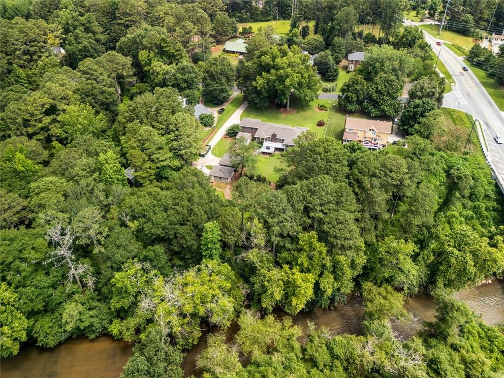 1535 Pathfinder Way Southwest Lilburn, GA 30047 - Photo 53 of 58 a view of a yard with plants