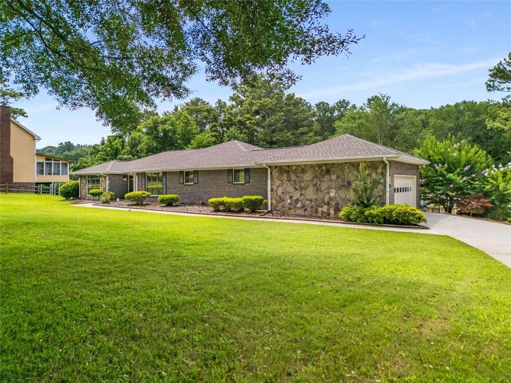 1535 Pathfinder Way Southwest Lilburn, GA 30047 - Photo 57 of 58 a view of a house with a yard