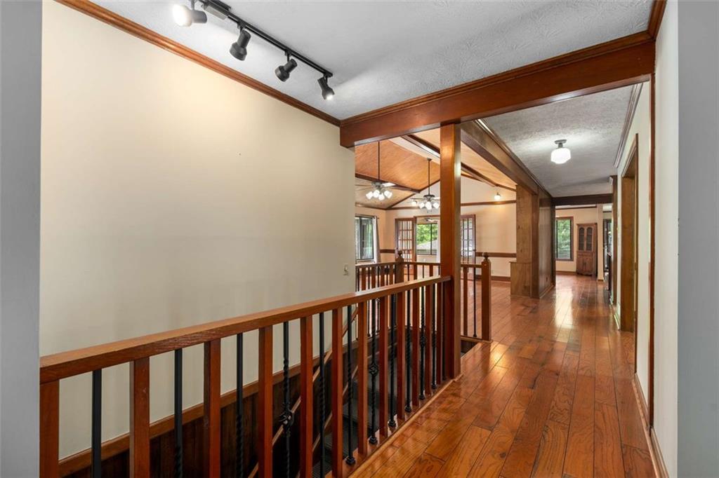 1535 Pathfinder Way Southwest Lilburn, GA 30047 - Photo 6 of 58 a view of entryway and hall with wooden floor