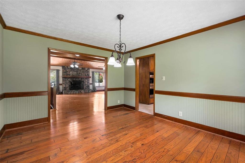 1535 Pathfinder Way Southwest Lilburn, GA 30047 - Photo 10 of 58 a view of a room with wooden floor fire place