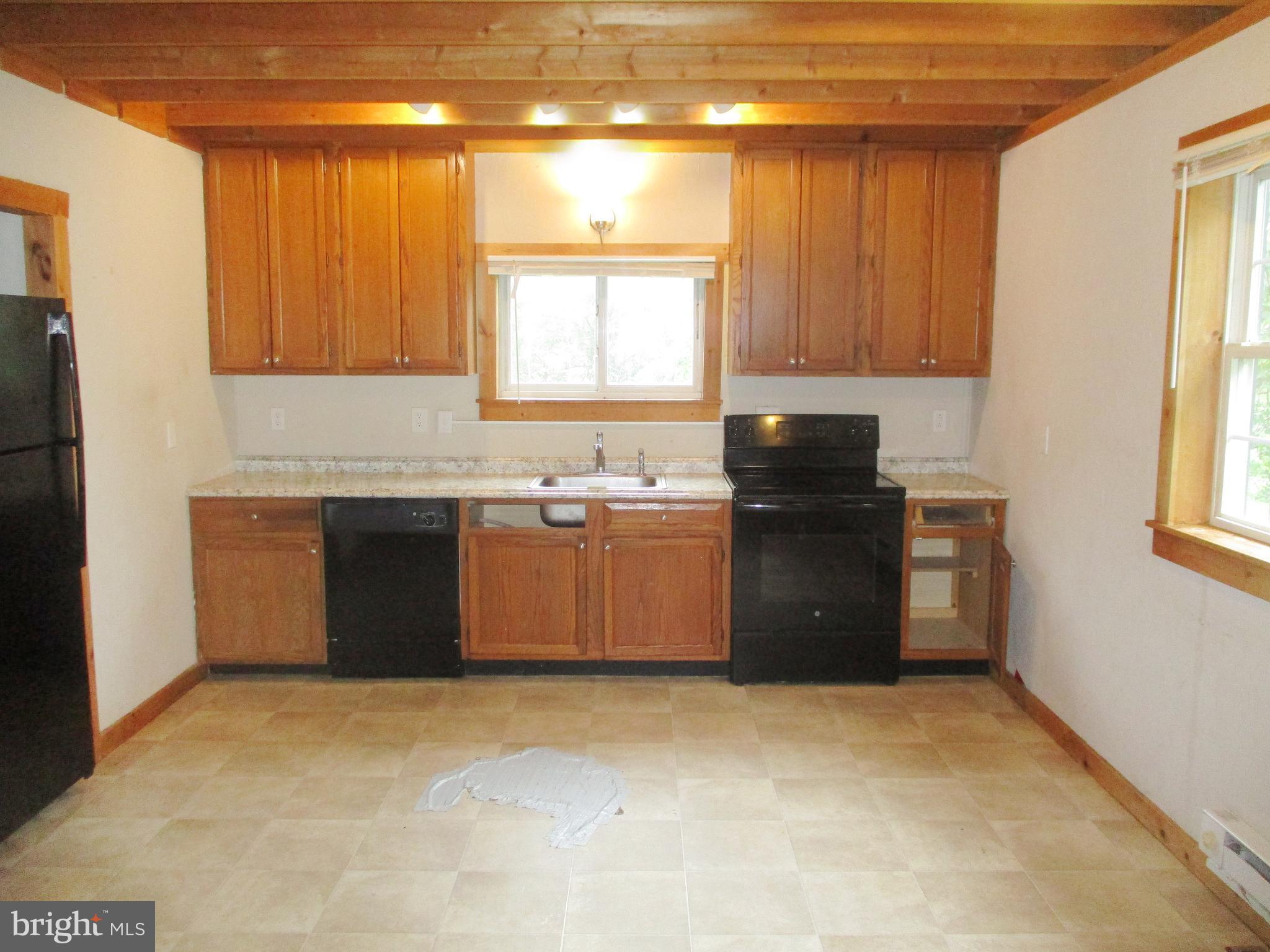 18 Airport Road Bethel, PA 19507 - Photo 4 of 12 a kitchen with a sink cabinets and a window
