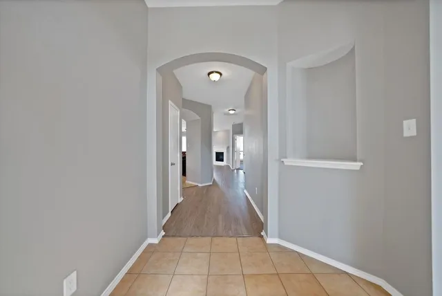 a view of a hallway with a chair