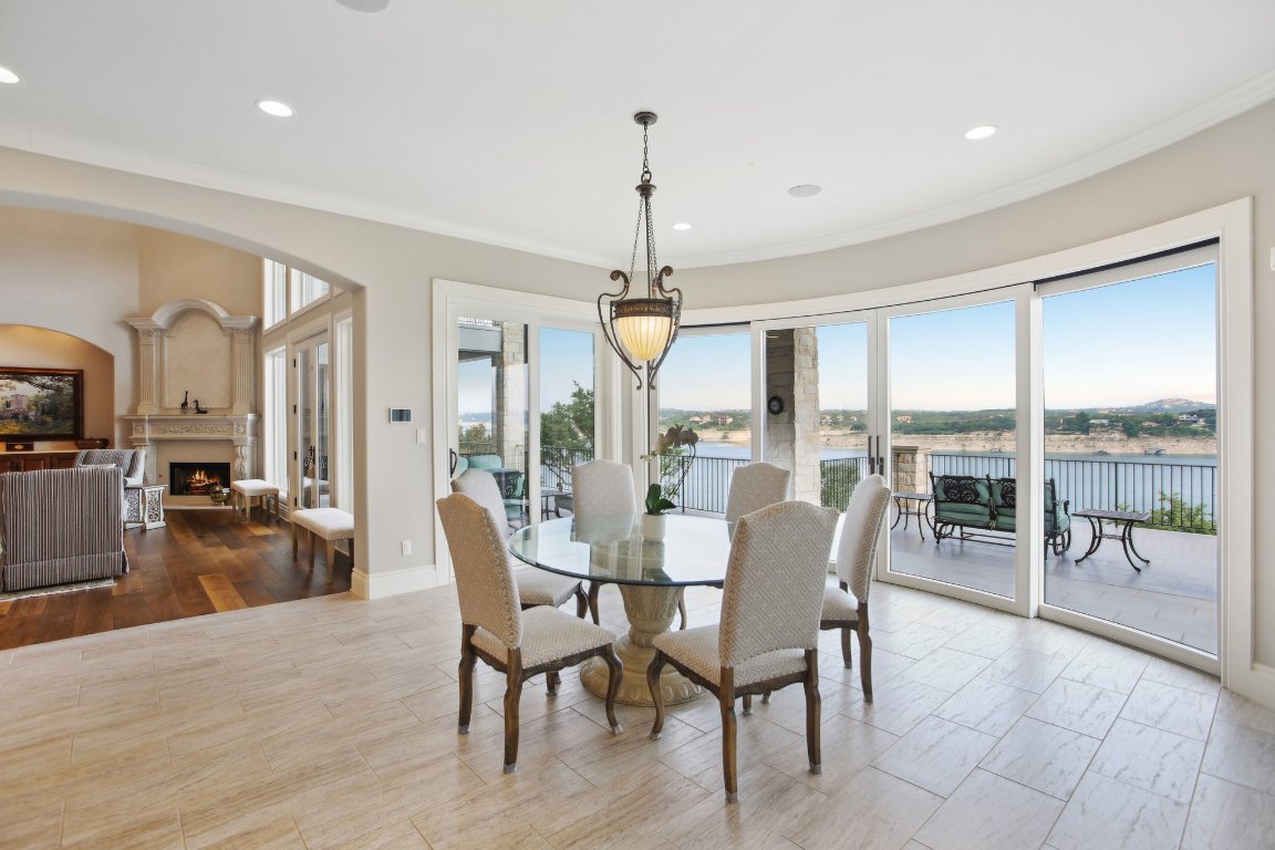 1353 Osprey Ridge Loop Lago Vista, TX 78645 - Photo 11 of 40 Notice the curved glass sliding doors (one of four sets in the home).
