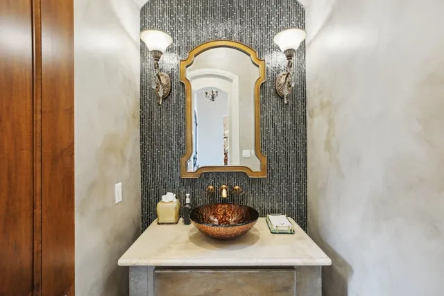 a living room with furniture and a ceiling fan