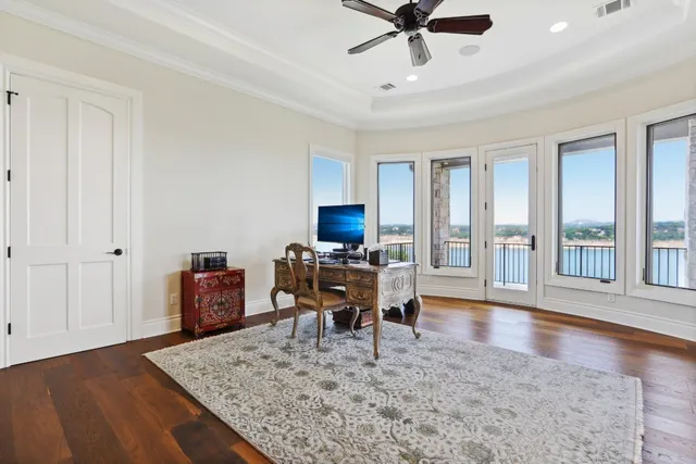 a view of a roof deck with table and chairs