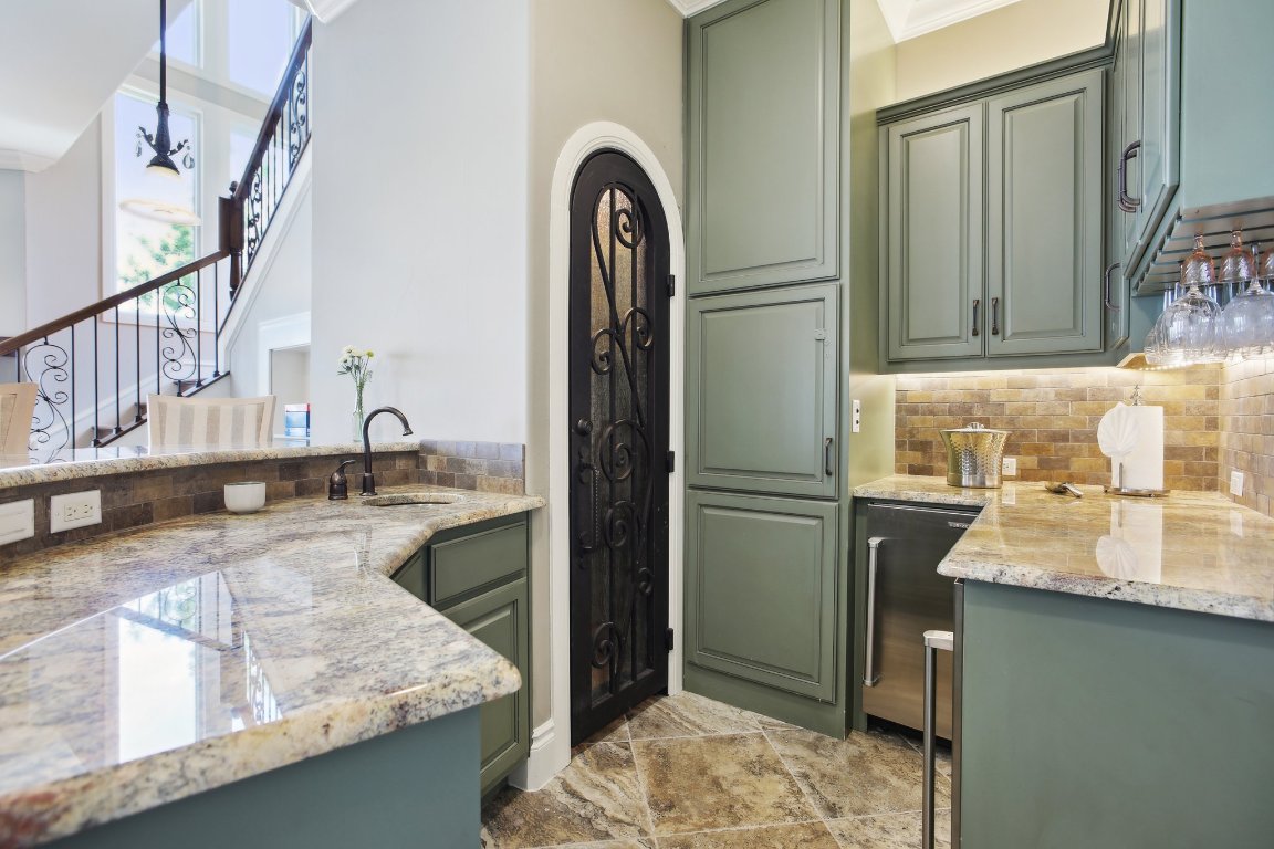 1353 Osprey Ridge Loop Lago Vista, TX 78645 - Photo 25 of 40 a kitchen with sink refrigerator and stove