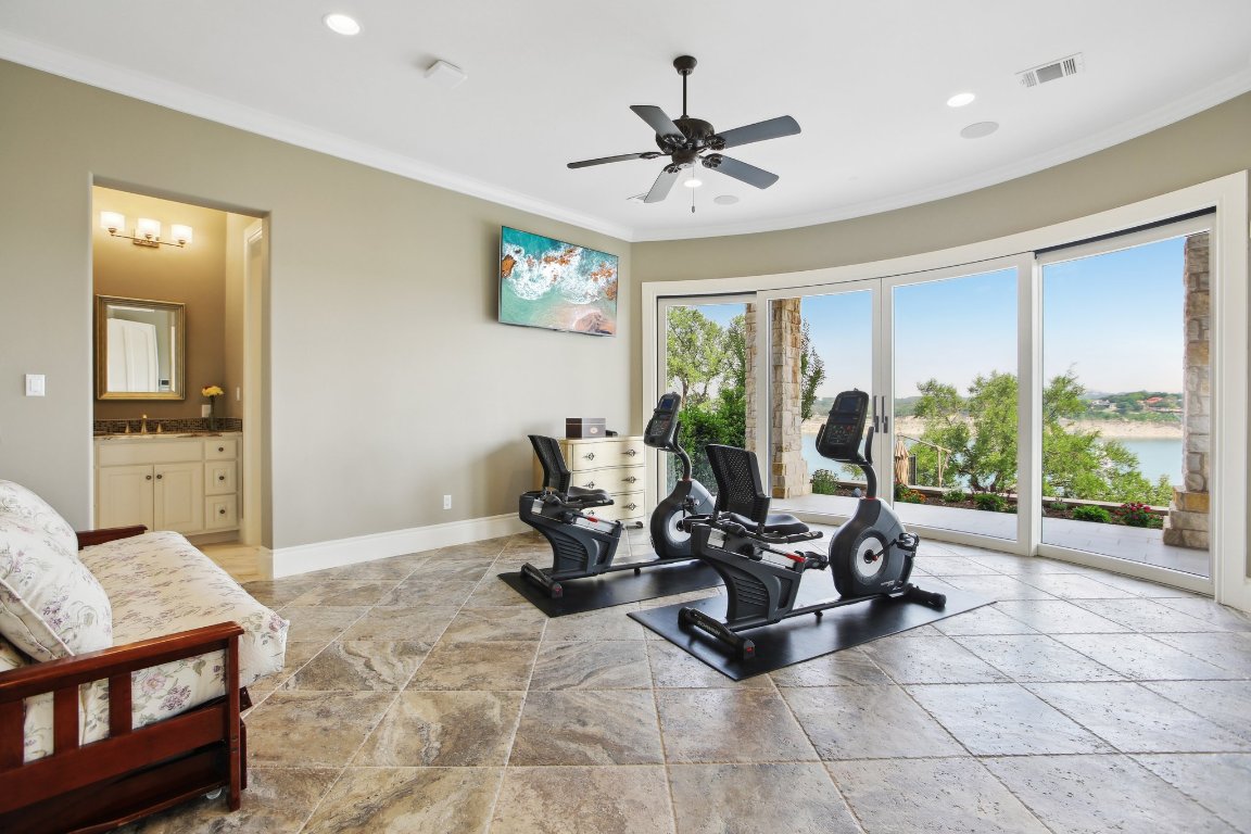 1353 Osprey Ridge Loop Lago Vista, TX 78645 - Photo 28 of 40 a living room with furniture and a floor to ceiling window