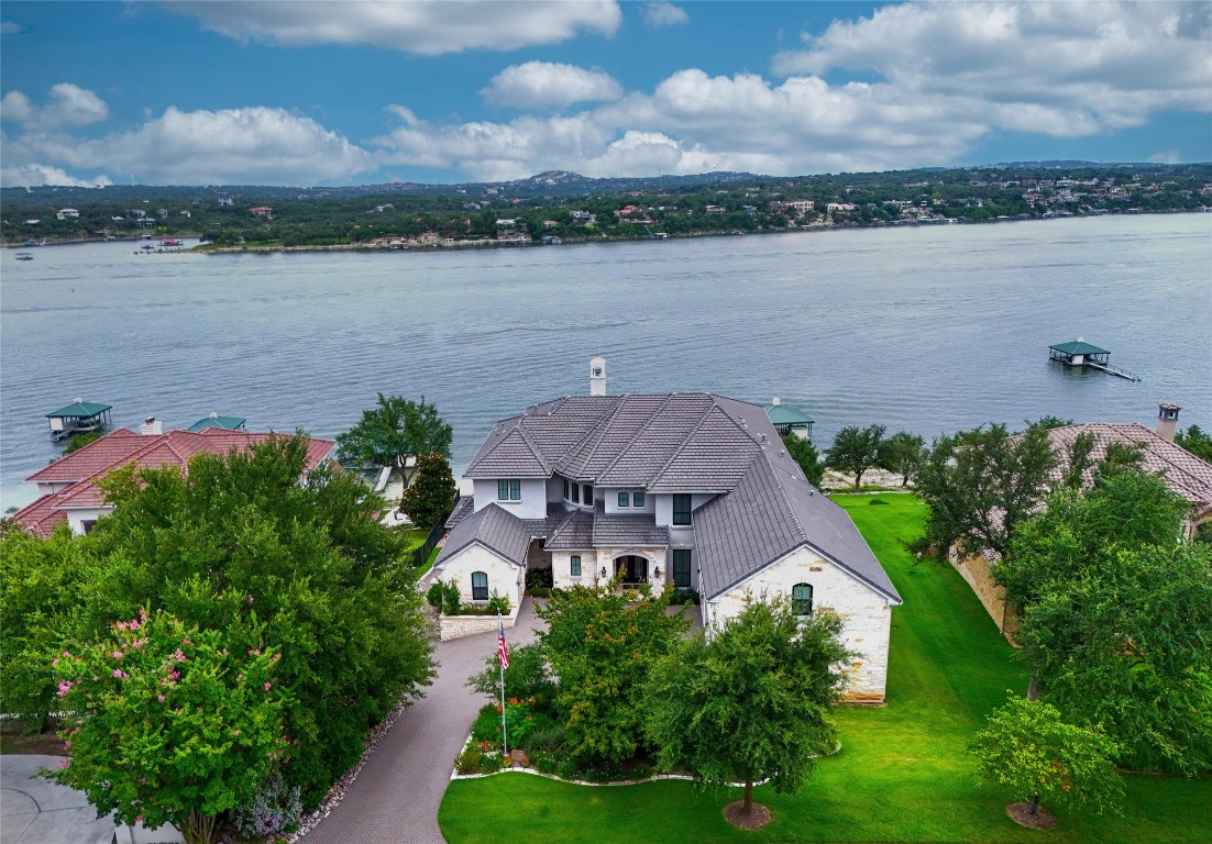 1353 Osprey Ridge Loop Lago Vista, TX 78645 - Photo 3 of 40 an aerial view of a house with a lake view