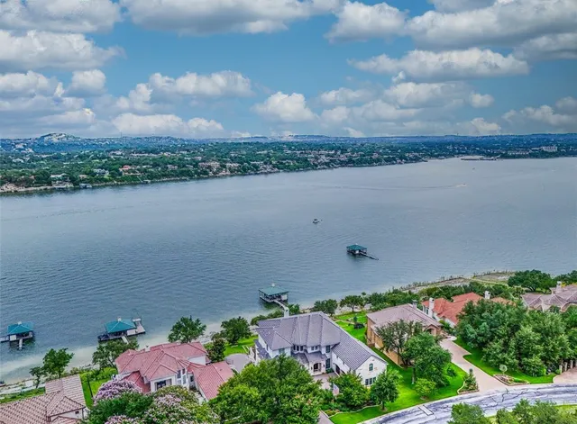 a view of swimming pool with a lounge chairs